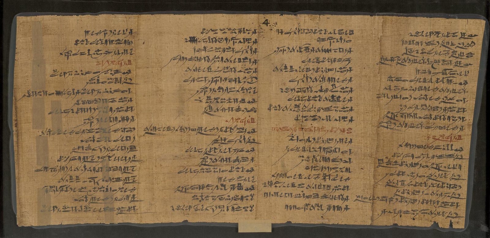 A papyrus covered in neat hieratic Egyptian script, the Instruction of Amenemope.