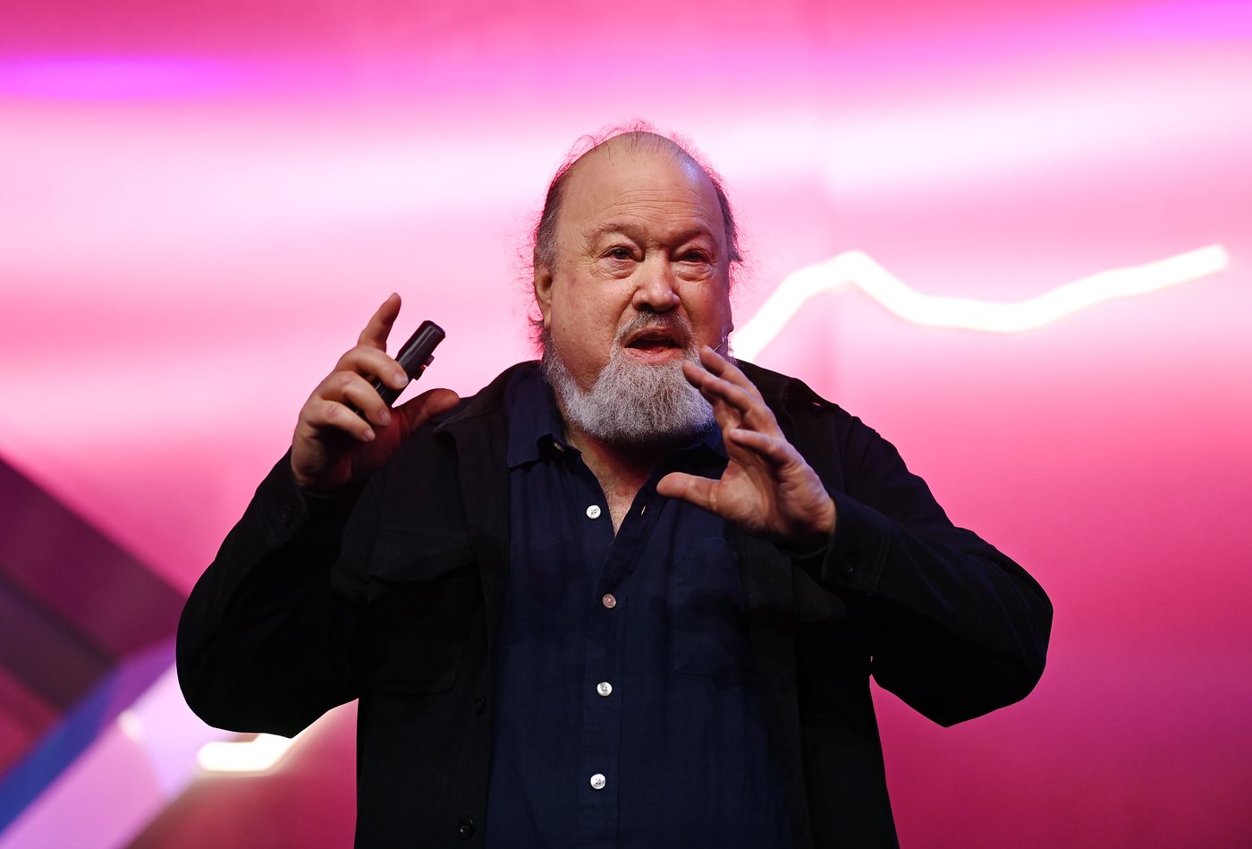 David Chaum speaking on stage at a technology conference in 2022.