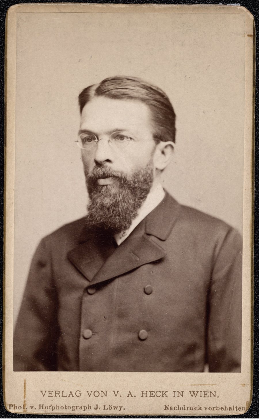 Studio portrait of Carl Menger in a dark coat, around 1886.