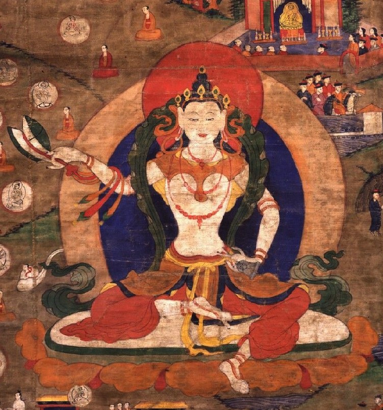An older thangka of Machig Labdrön, white-bodied and seated in silk robes, drum raised in her right hand and a bell in her left, with a red halo and small scenes of monks and visitors around her.
