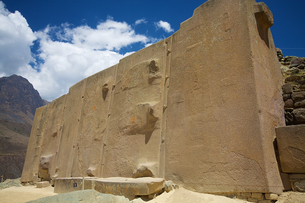The Wall of the Six Monoliths at Ollantaytambo, six vast dressed stones standing in a row with thin dressed spacers between them.